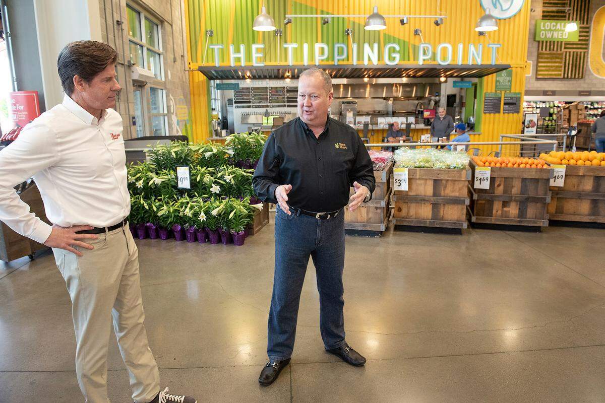 Executive Chairman Shane Sampson, right, and and CEO Chris McGarry, left, give the Bee at tour of the Save Mart supermarket on Oakdale Road in Modesto, Calif., on Wednesday, April 6, 2022.