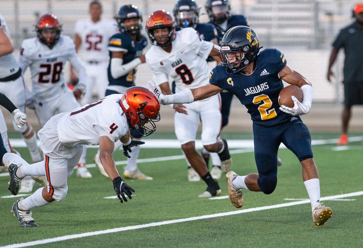 Gregori’s Ayden Powers returns a kick as Merced’s Gabriel Courtney (4) attempts a tackle during the non-league game at Gregori High School in Salida, Calif., on Friday, August 26, 2022.