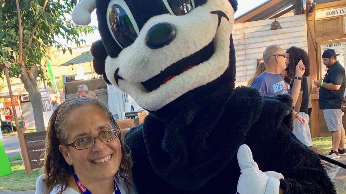 Modesto Bee reporter ChrisAnna Mink with mascot Scoopy at the Stanislaus County Fair in 2019.