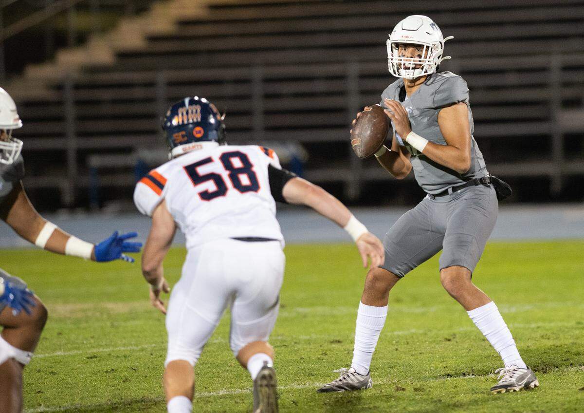 Modesto quarterback Keith Orona looks to pass during the game with College of the Sequoias at Modesto Junior College in Modesto, Calif., Saturday, Nov. 5, 2022.