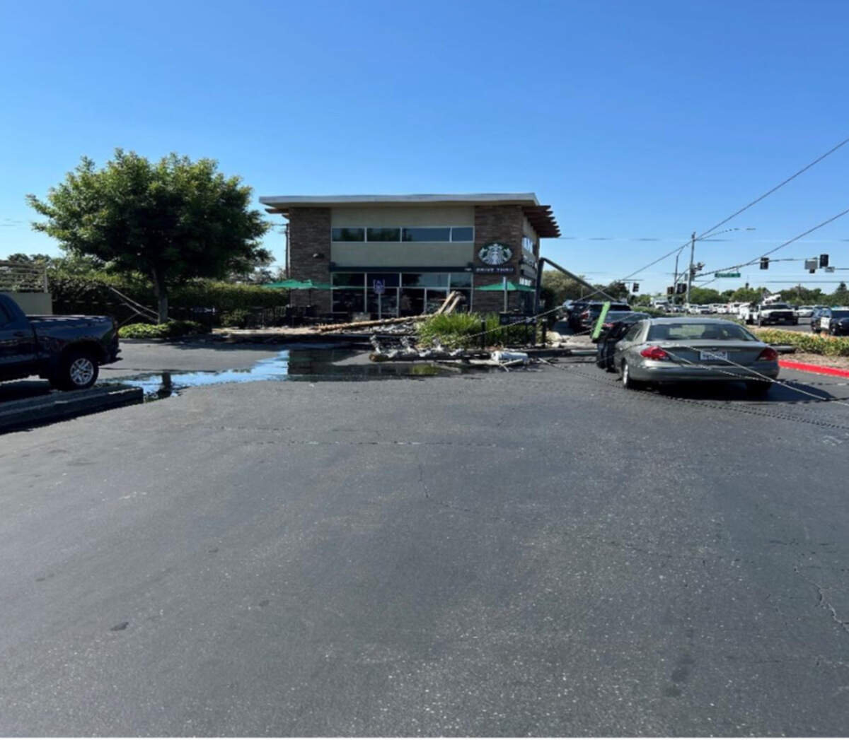 Downed powerlines at Starbucks on Oakdale Road on Monday, June 30, 2025.