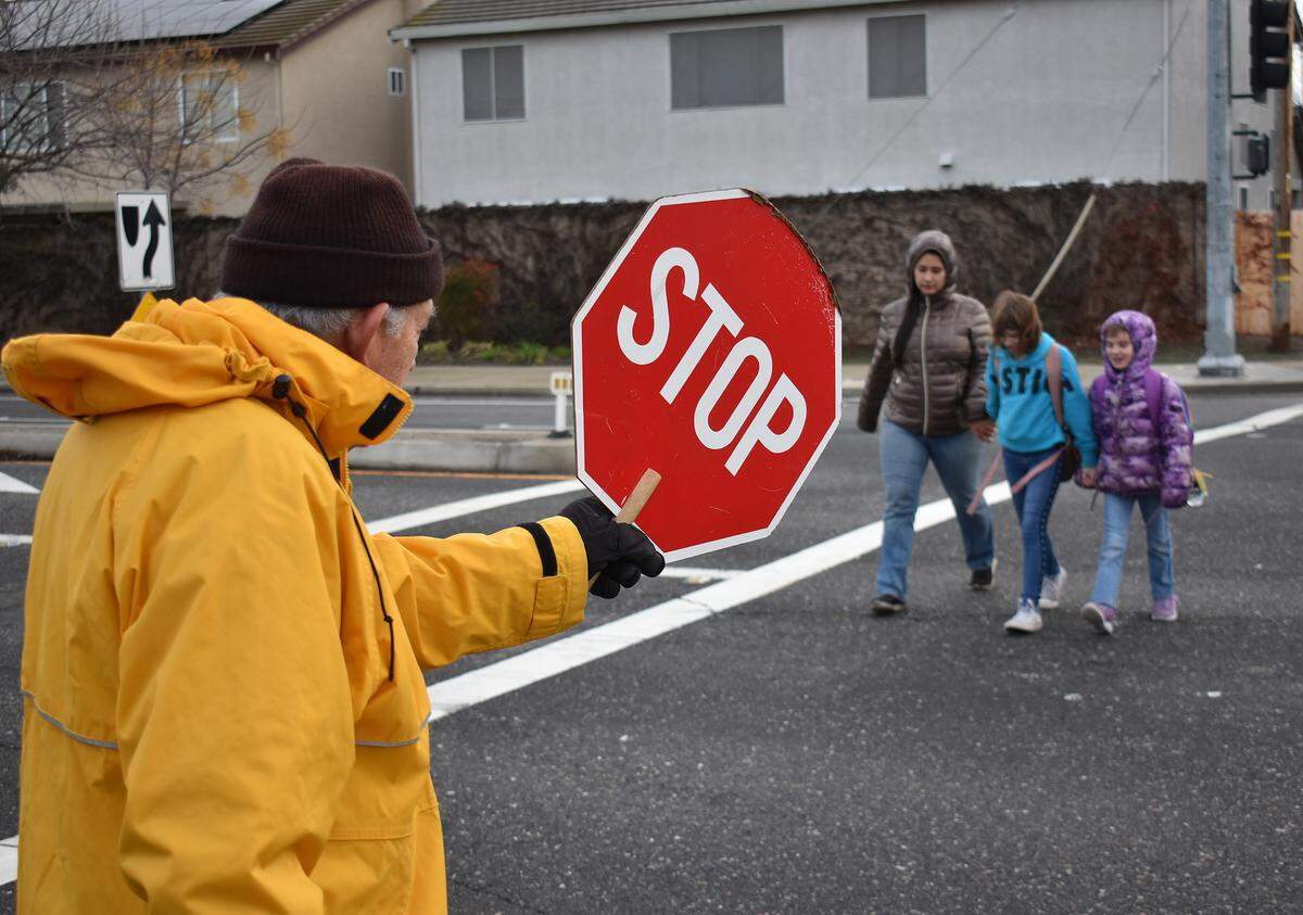 Bob Luna, 84, works as a crossing guard for Stanislaus Union School District at the corner of Prescott Road and Snyder Avenue the morning of Jan. 16, 2019. He’s been at it for 14 years, he says.