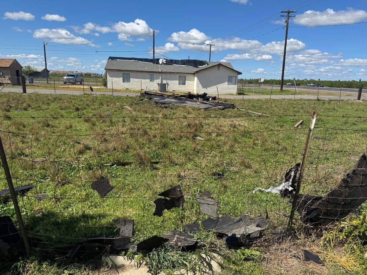 The roof of an unoccupied house lays in the side acre of Walter Roger Cole’s property after a tornado touched down in Modesto on Tuesday, April 1.
