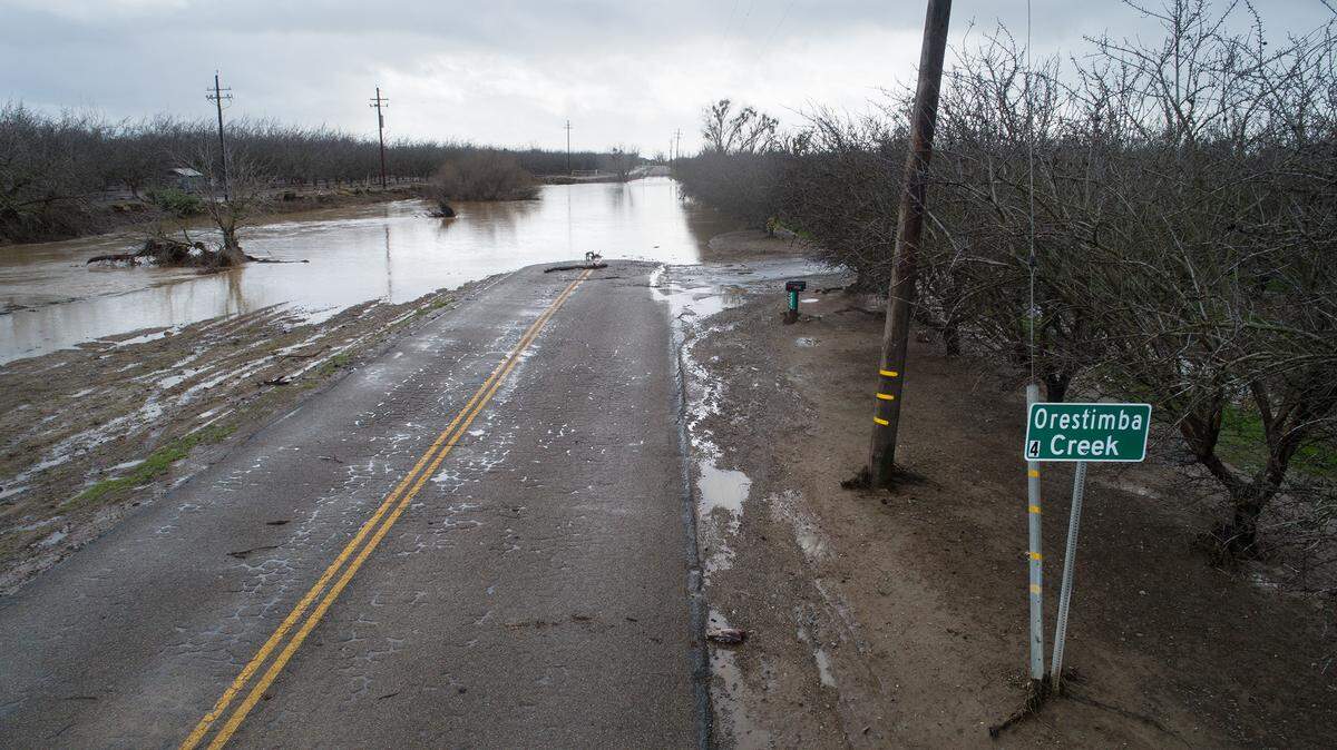Orestima Creek has flooded Eastin Road in Newman, Calif., Tuesday, Jan. 10, 2023.
