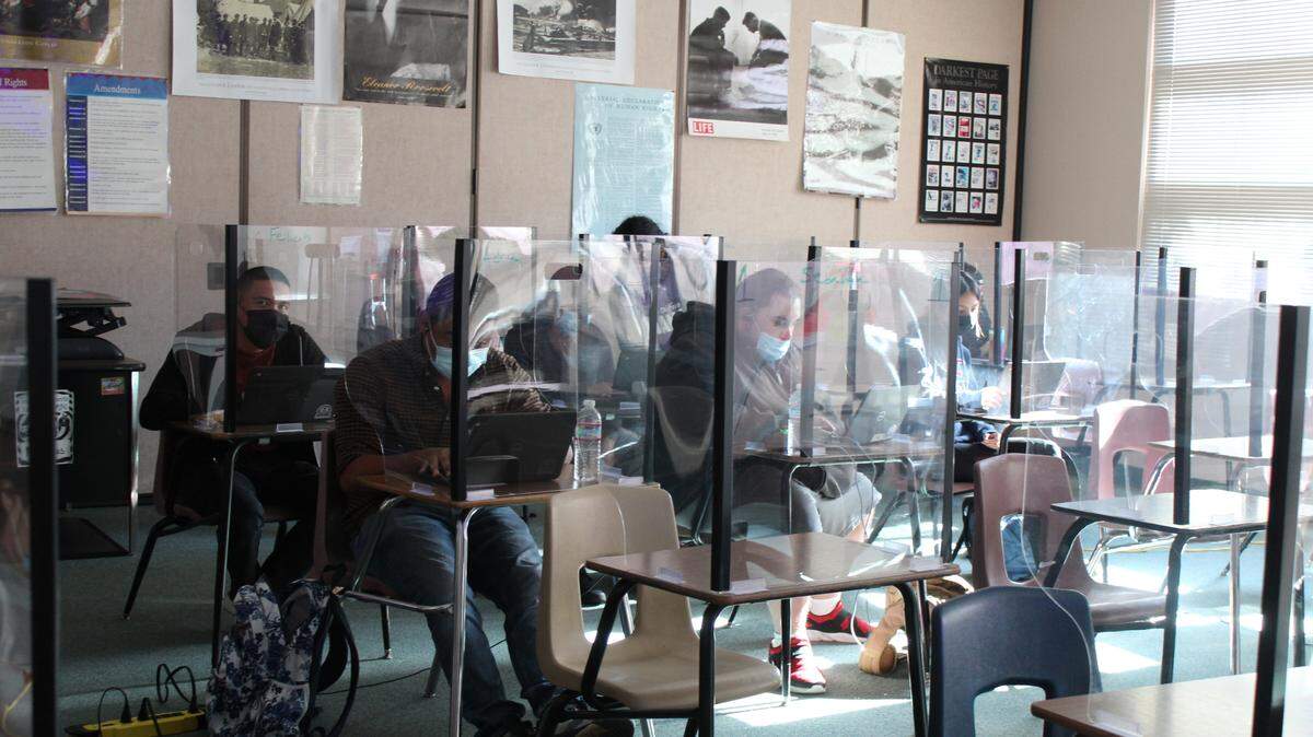 High school students work through classes in summer school at Johansen High School. All students must continue wearing masks in school buildings this fall.