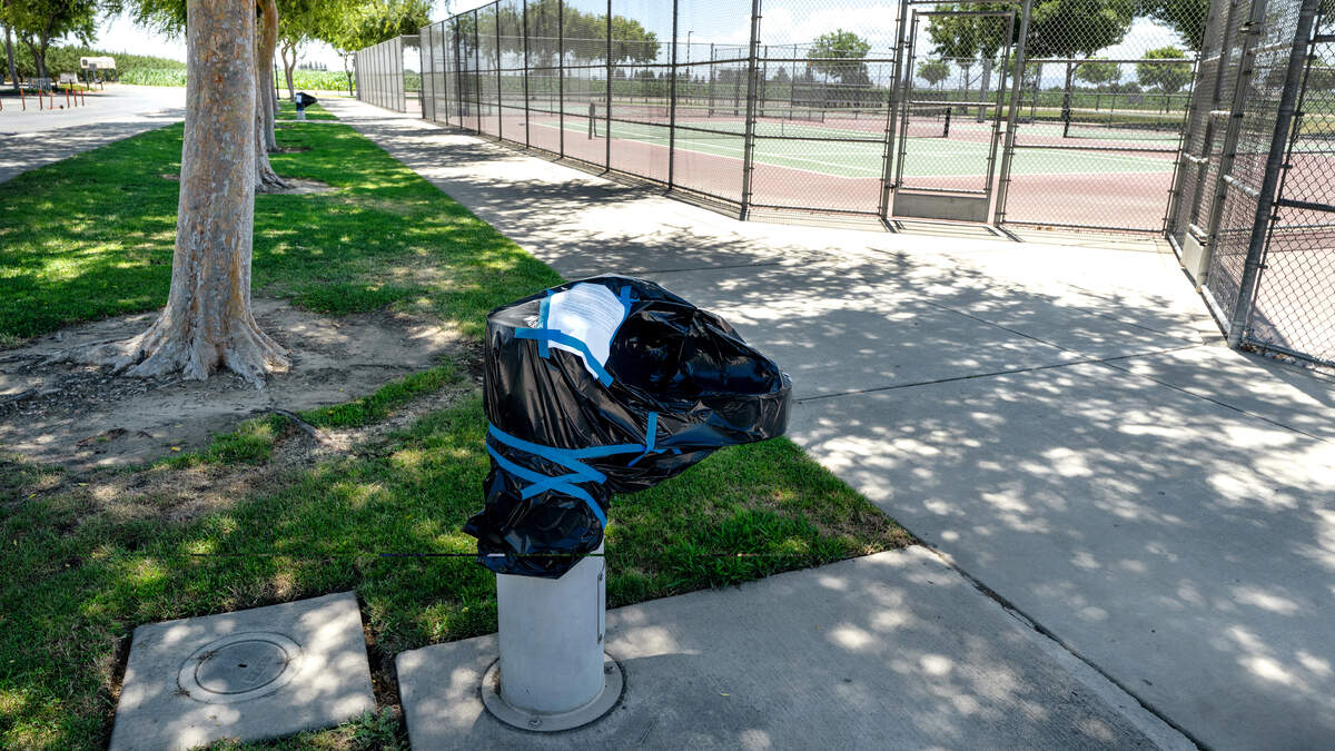 A water fountain is covered at the Gregori High School tennis courts after elevated levels of lead were found during testing. Photographed in Modesto, Monday, June 29, 2026