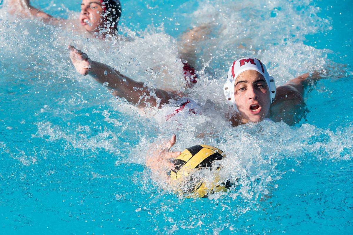 Modesto High’s Arlan Yerby gathers up a loose ball during the DeLong Water Polo Tournament game with Mt. View of Oregon at Enochs High School in Modesto, Ca., on Friday, Oct. 19, 2018.