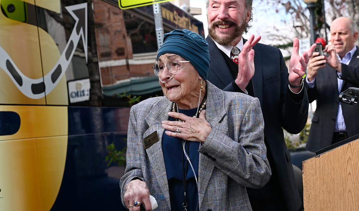 Jenny Kenoyer reacts as the SRTA reveals the first repainted bus for her. The newly branded Stanislaus Regional Transit Authority bus was officially unveiled in Modesto, Calif., on Thursday, Dec. 16, 2021. The Modesto Area Express, better known as MAX, and Stanislaus Regional Transit, or START have merged into one provider, Stanislaus Regional Transit Authority.