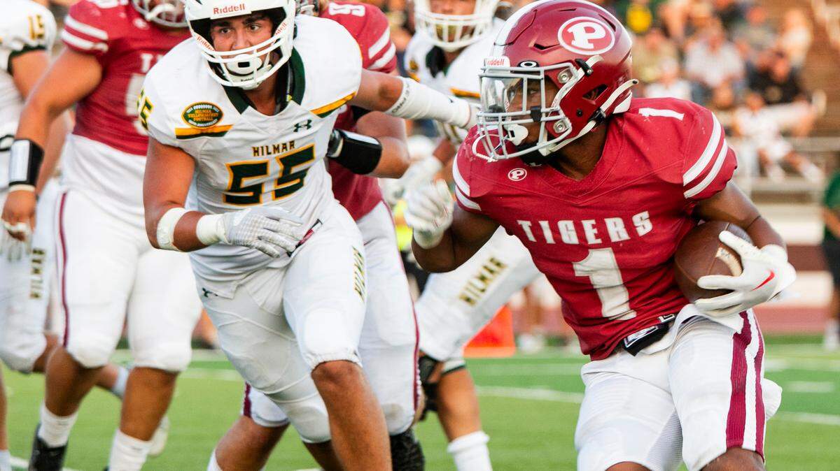 Jeremiah Lugo, 1, of Patterson High works his way up field with Hilmar defense closing in.