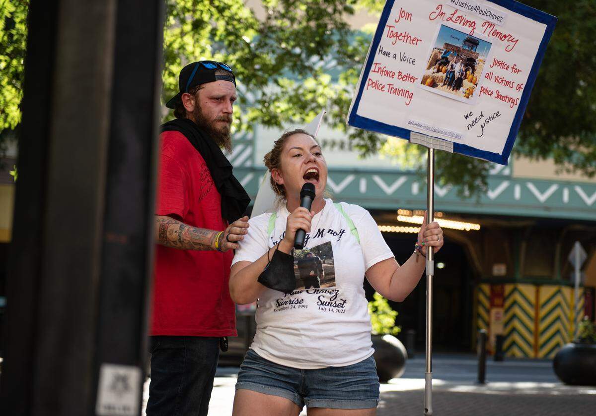 Brittoni Estrella Chavez, widow of Paul Chavez Jr., protests outside 10th Street Place before the Modesto City Council meeting in Modesto, Calif., on August 23, 2022.