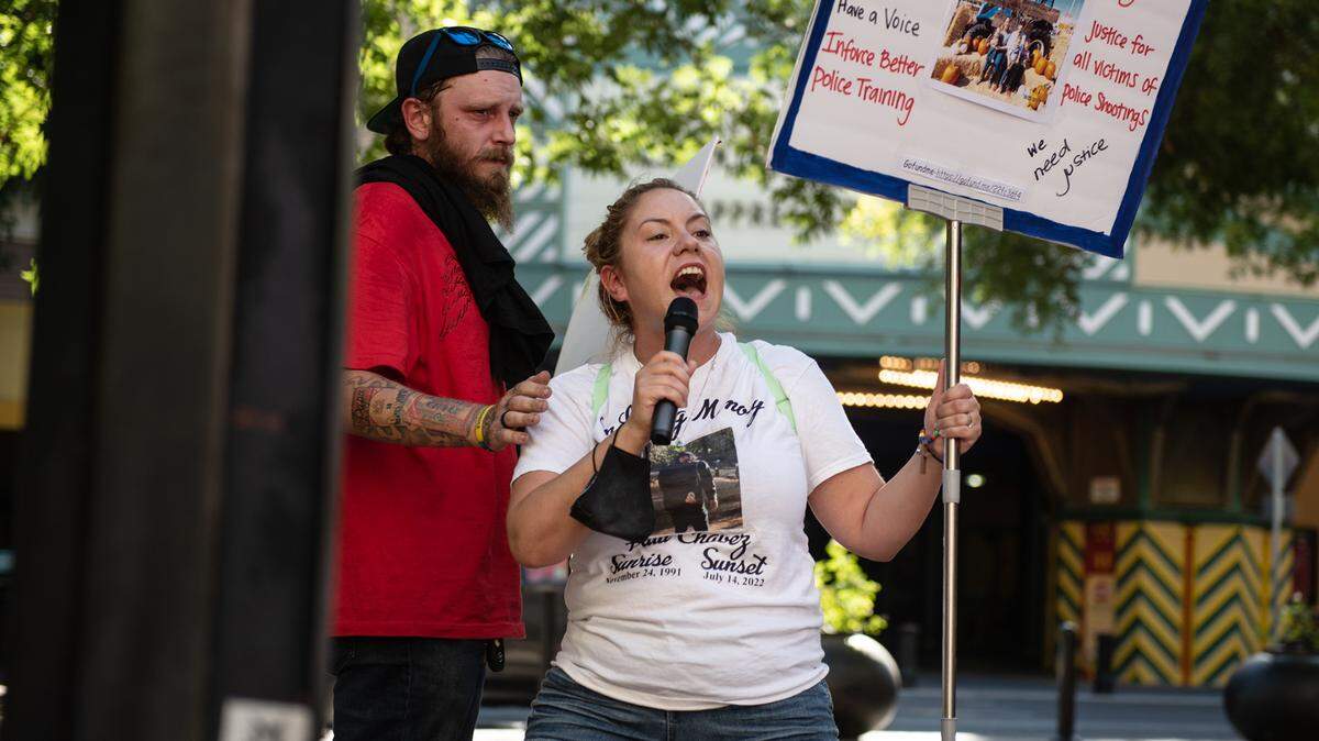 Brittoni Estrella Chavez, widow of Paul Chavez Jr., protests outside 10th Street Place before the Modesto City Council meeting in Modesto, Calif., on August 23, 2022.