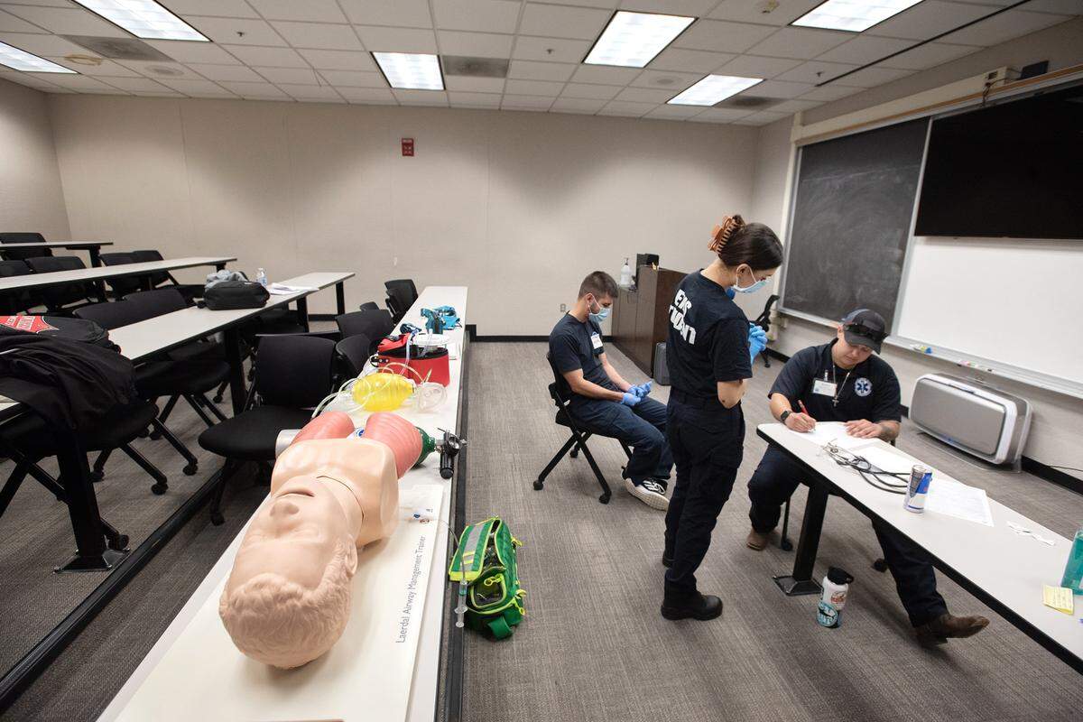 Proctor Briana Villa, seated, tests EMS student Makenzie Mason during Emergency Medical Responder training at the Regional Fire Training Center in Modesto, Calif., Tuesday, March 7, 2023. The
