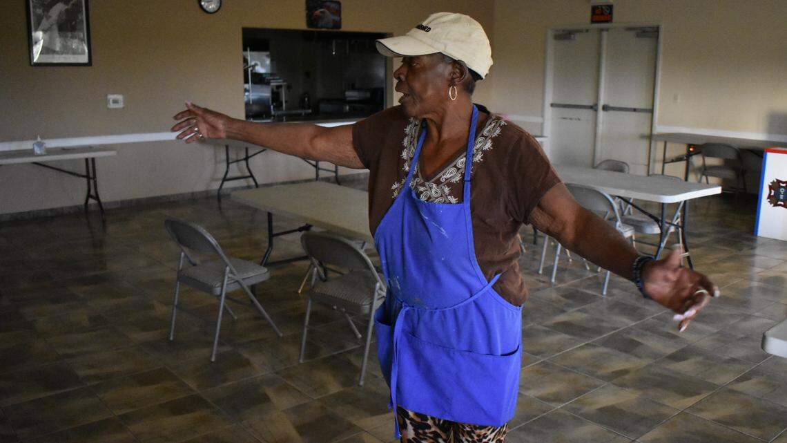 Arlene Martinez, president of the VFW Post 3199 Auxiliary in Modesto, shows how social distancing cut deeply into the number of tables set up in the dining hall of the Hatch Road facility.