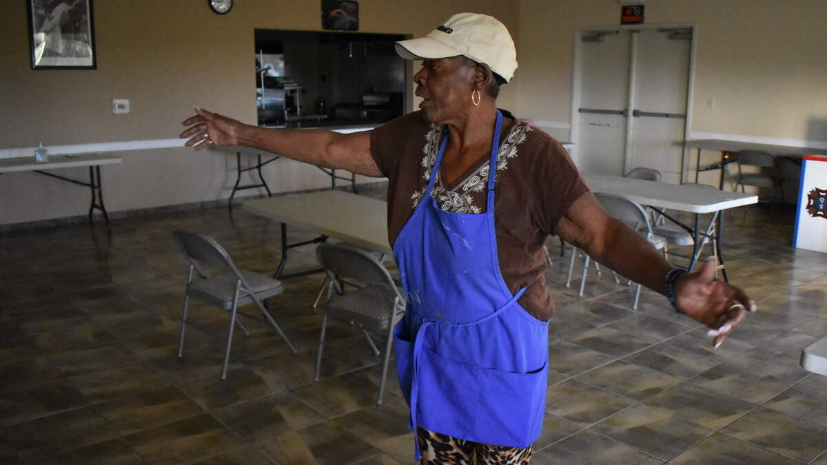 Arlene Martinez, president of the VFW Post 3199 Auxiliary in Modesto, shows how social distancing cut deeply into the number of tables set up in the dining hall of the Hatch Road facility.