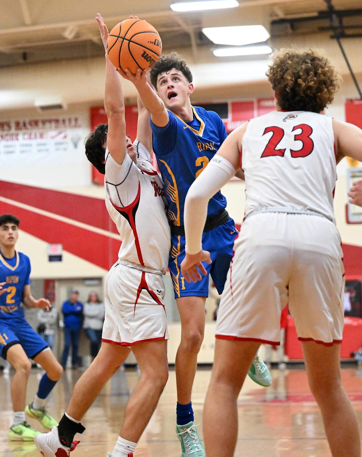 Ripon Christian’s Jake Vander Veen flips the ball in for two of his 19 points during the Trans Valley League game with Ripon at Ripon High School in Ripon, Calif., Friday, Feb. 9, 2024.