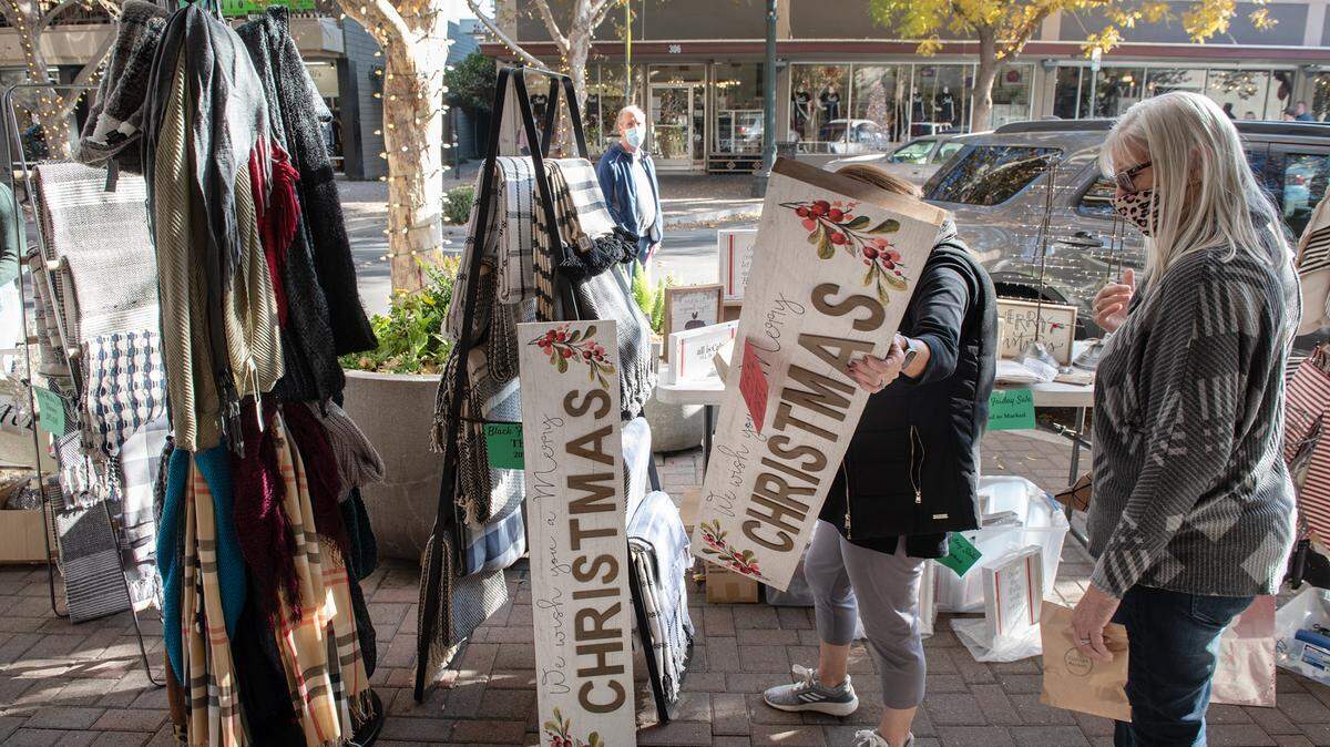 Tammy Rocha, right, and Joanna Rose, middle, browse items at Farmhouse during in Turlock, Calif., on Saturday, Nov. 28, 2020.