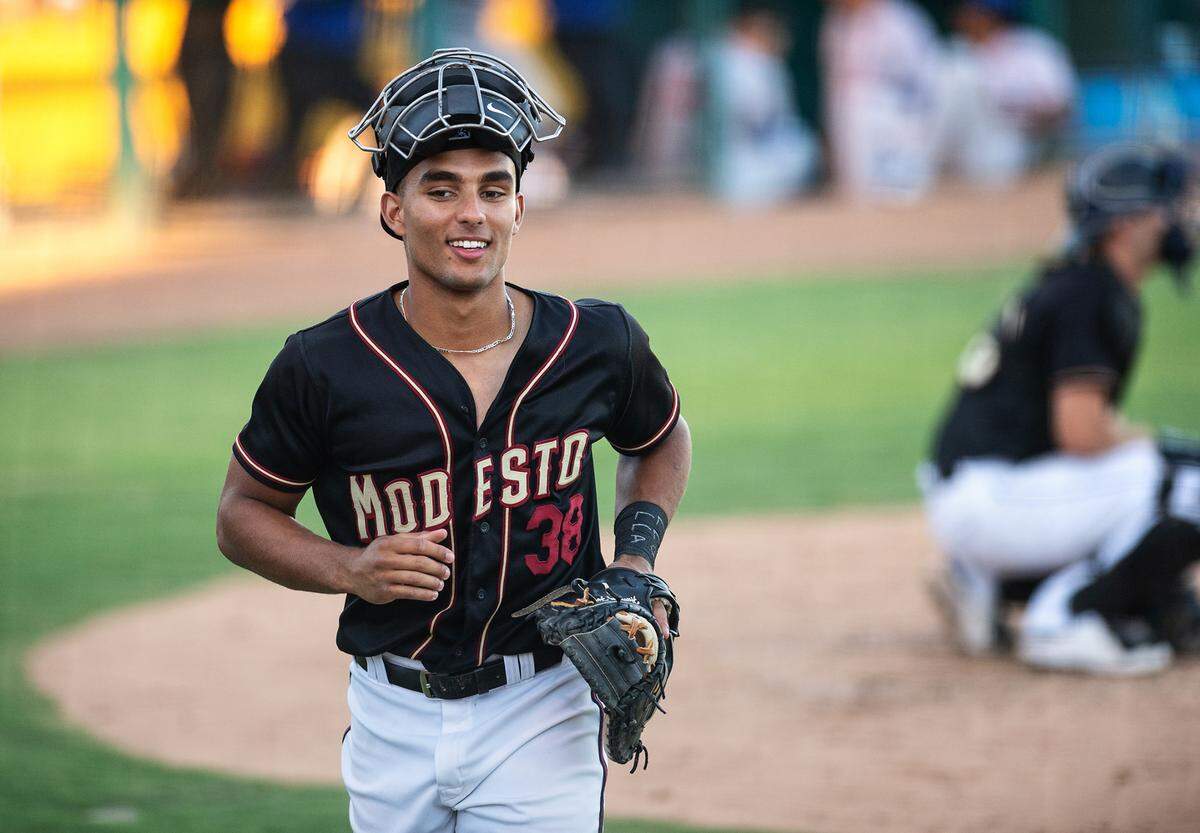 Modesto Nuts catcher Harry Ford comes off the field after warming up the pitcher during the California League game with the Stockton Ports at John Thurman Field in Modesto, Calif., on Wednesday, July 6, 2022. Ford was the designated hitter during the game.