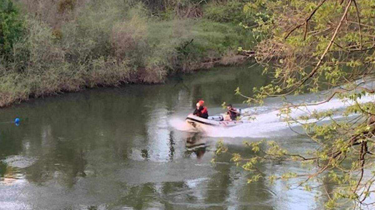 A rescue boat crew looks in the area of Jacob Myers Park in Riverbank for juveniles who were reported stuck in the Stanislaus River on Sunday after their raft failed. The youth ended up being located in the Caswell Memorial State Park area and were airlifted from the river.