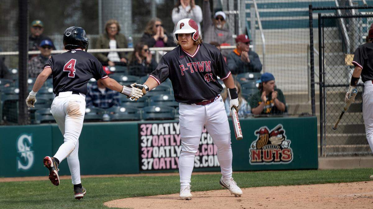 Patterson’s Max Medina scores and teammate Guy Allard heads to the batters box during the Modesto Nuts High School Baseball Showcase game with Hilmar at John Thurman Field in Modesto, Calif., Saturday, March 23, 2024.