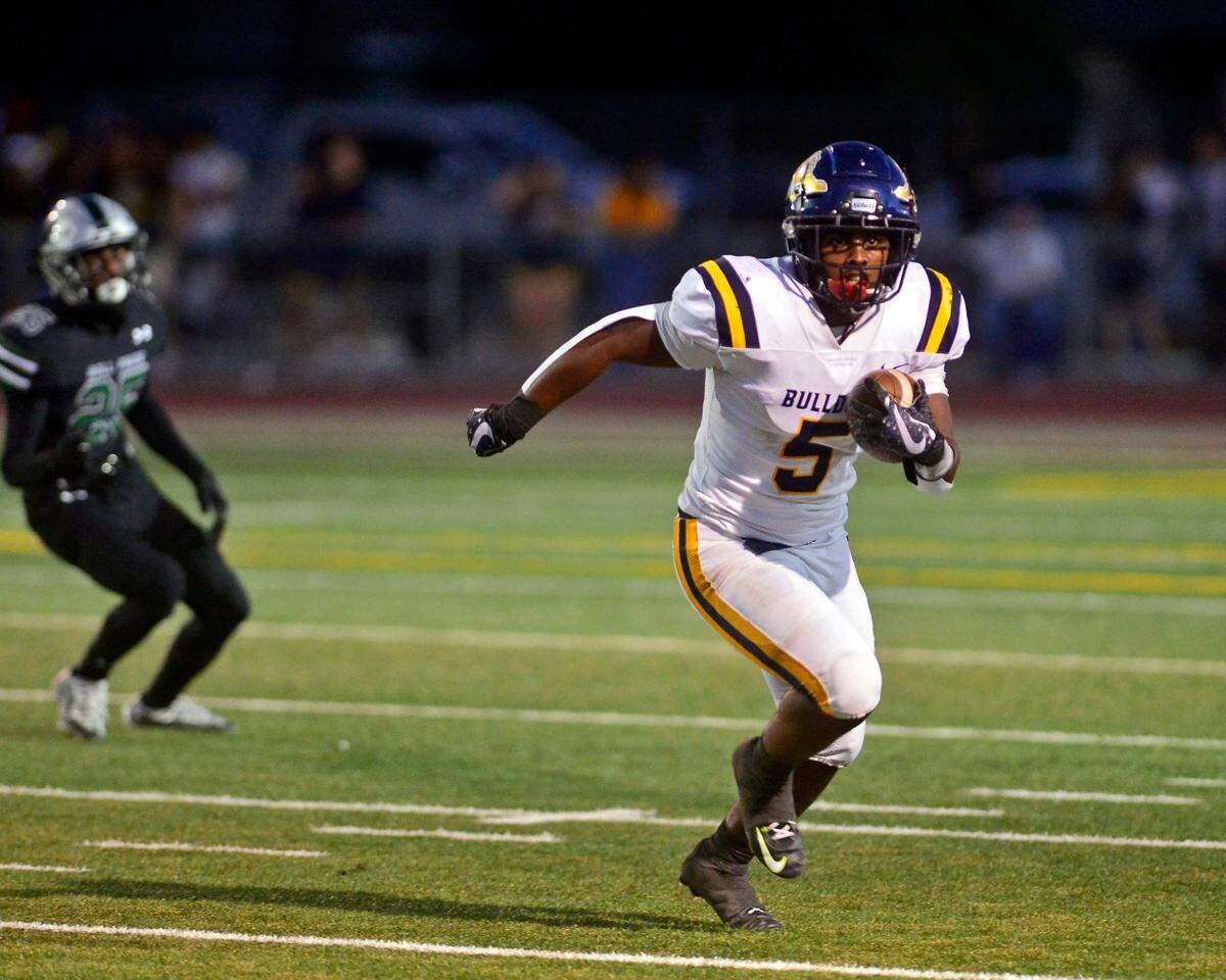 Turlock running back J.T. Foreman II runs the ball during a game between Turlock High School and Pitman High School at Turlock High School in Turlock, Calif., on September 30, 2022.