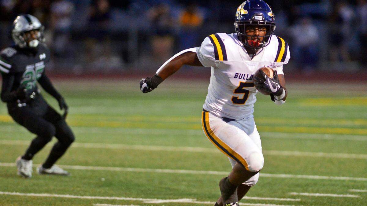 Turlock running back J.T. Foreman II runs the ball during a game between Turlock High School and Pitman High School at Turlock High School in Turlock, Calif., on September 30, 2022.