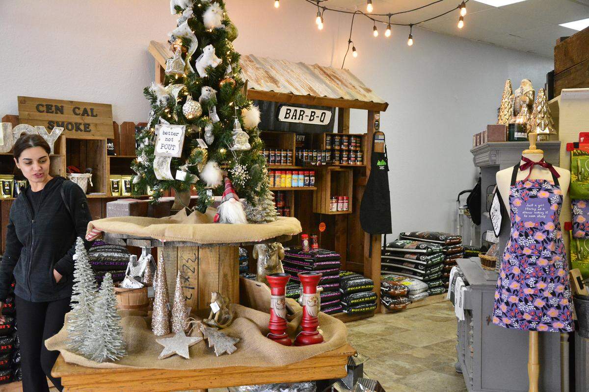 The new two-in-one store Cen Cal Smoke and Smoke & Magnoliias has opened in Roseburg Square in Modesto, Calif. Bee Zaya looks at items in the shop on Dec. 10, 2019.