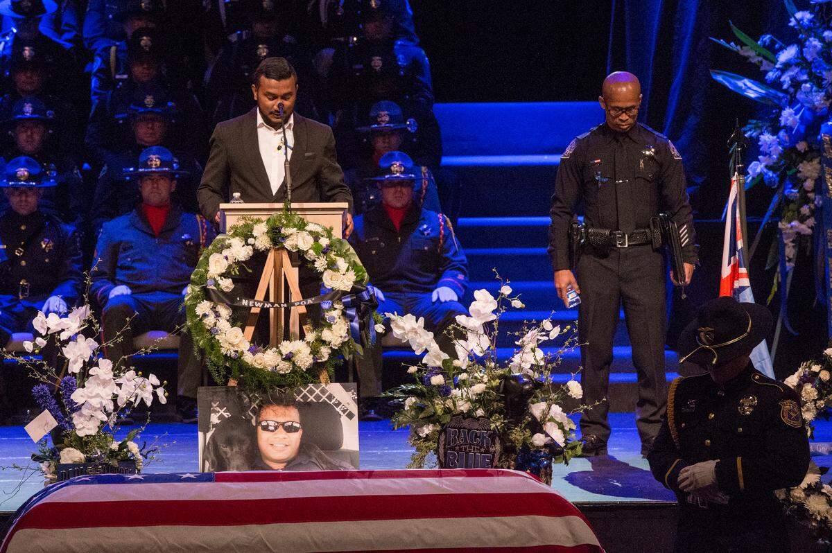 Rajnil Singh, the brother of Corporal Ronil Singh talks to over one thousand people during the memorial service Saturday Jan. 5, 2019. Over a thousand people showed their sympathy during the service at Crosspoint Community Church followed by a service at the Peace Officer Memorial site at Lakewood Memorial Park in Hughson, Ca.
