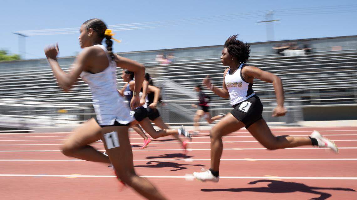 Girls run the 100 meter race during the Central California Athletic League track and field championships at Turlock High School in Turlock, Friday, May 2, 2025.