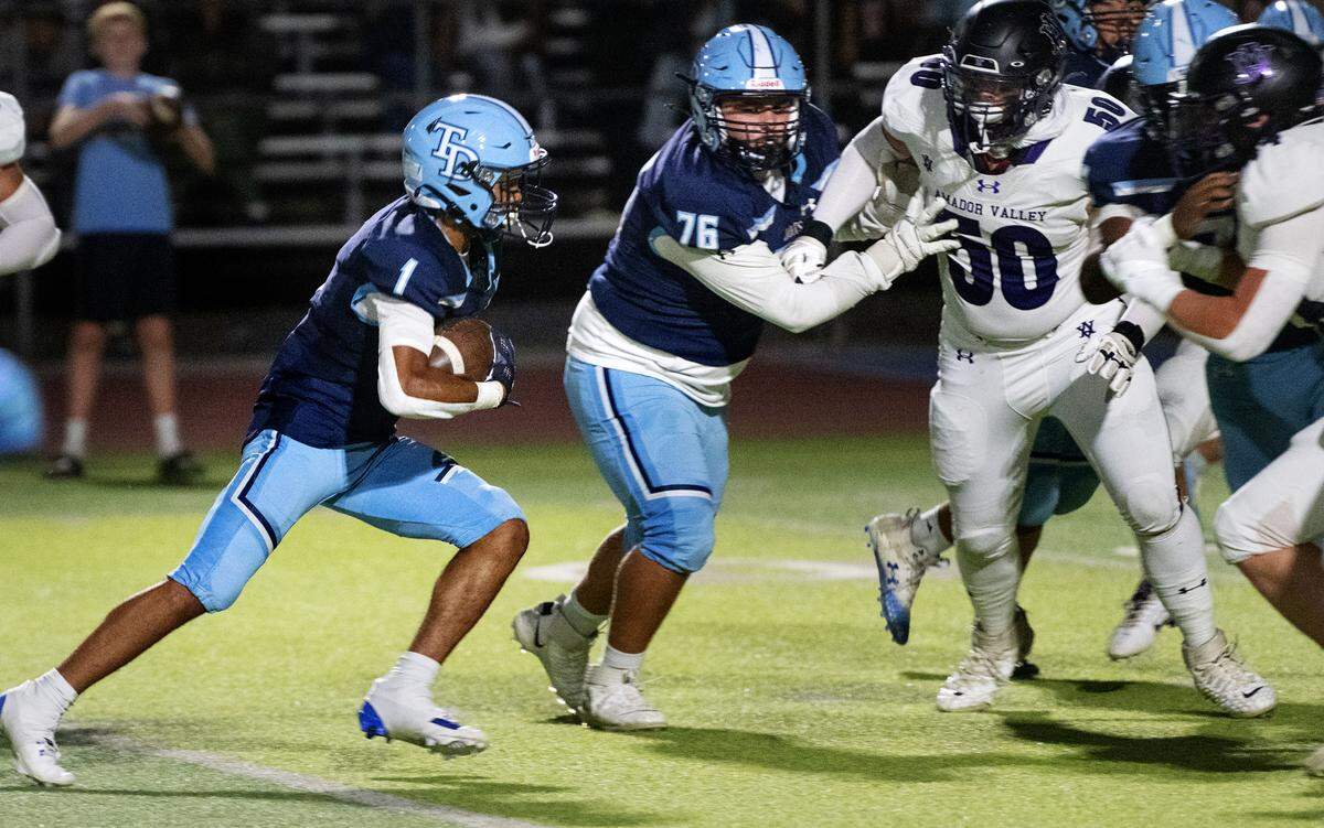 Downey’s Julius Padron scores a touchdown on a run during the non-league game with Amador Valley at Downey High School in Modesto, Calif., Friday, Sept. 13, 2024. Downey won the game 47-38.