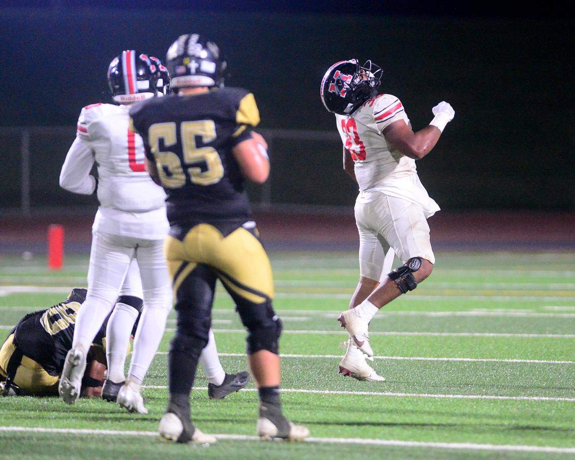 Modesto linebacker Melea Uili (33) celebrates a tackle for loss on a fourth-down stop during a game between Modesto High School and Enochs High School at Gregori High School in Modesto, CA on October 4, 2024.