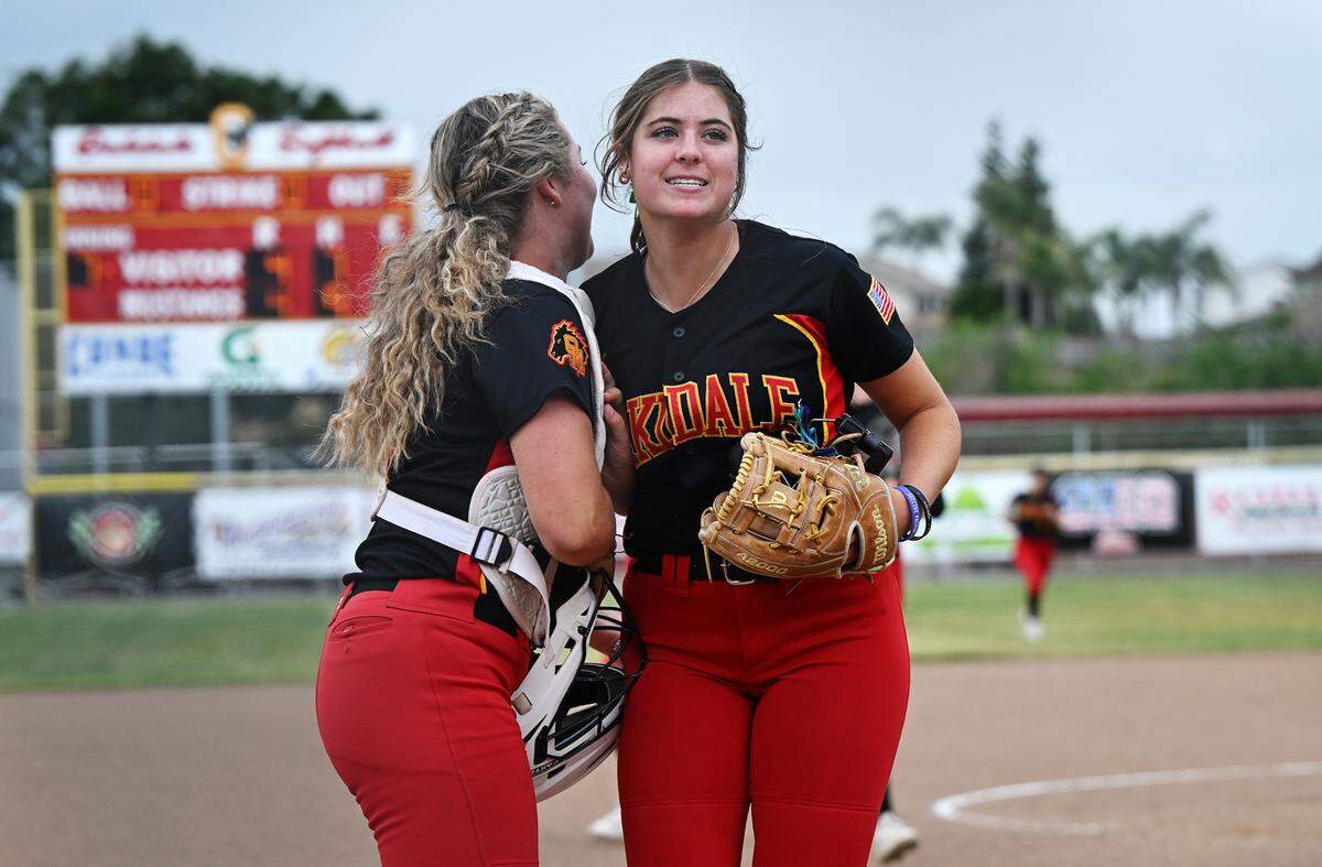 Oakdale’s Raegen Everett, right, and catcher Presley Barnes come off the field after retiring Kimball during the Valley Oak League game in Oakdale, Calif., Thursday, May 4, 2023.