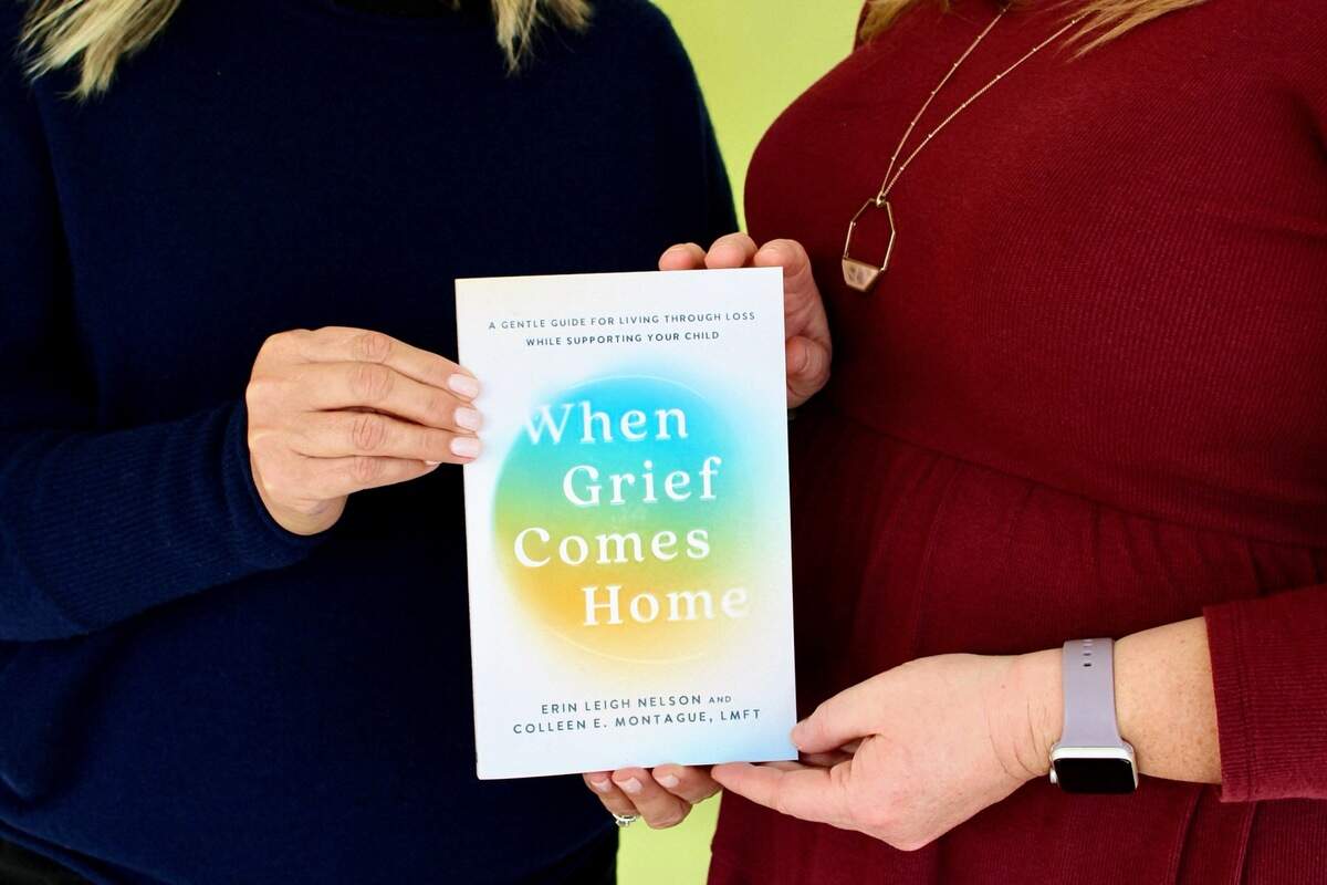 Authors Erin Nelson and Colleen E. Montague with their book, When Grief Comes Home published in February 2025.