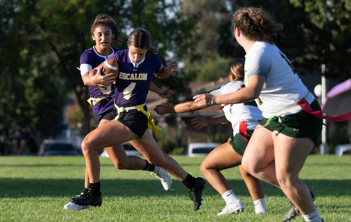 Escalon’s Rayah McNulty dodges defenders on a run during the game with Tracy at Escalon High School in Escalon, Calif., Wednesday, Sept. 13, 2023.