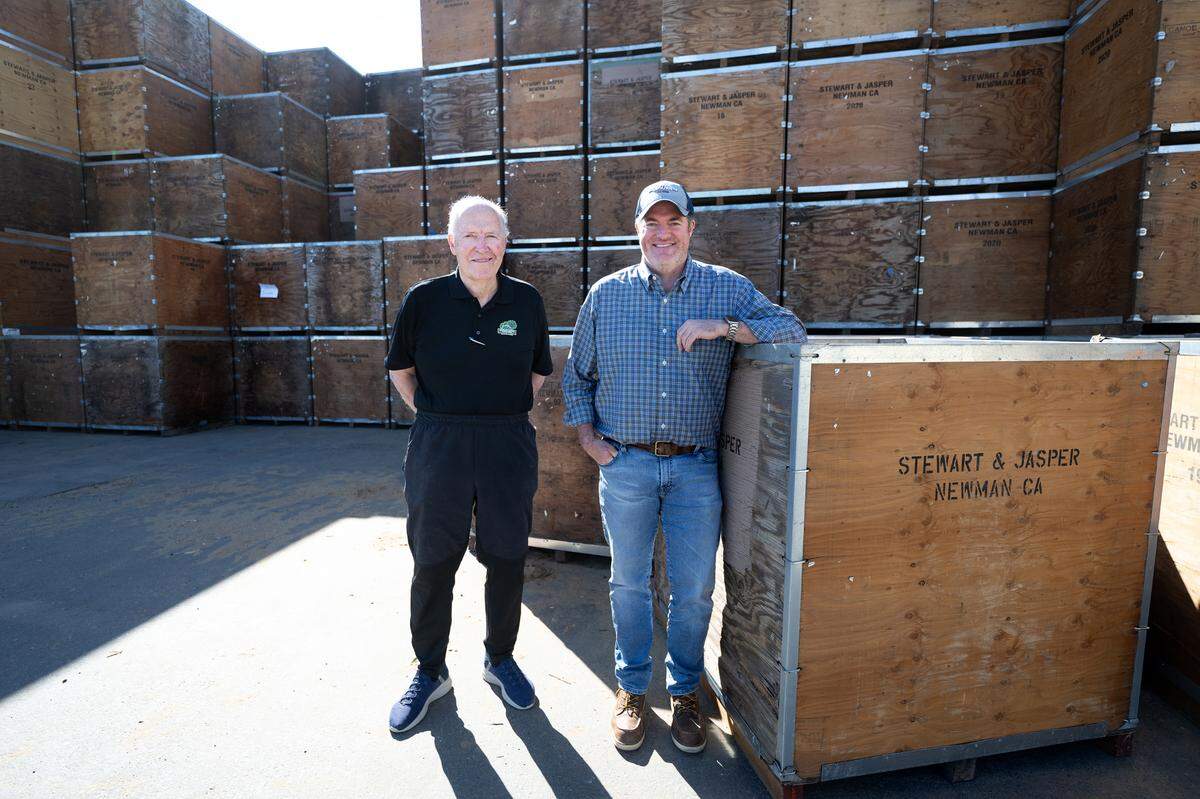 Stewart and Jasper Orchards president and vice-president Jim Jasper, left, and his son Jason, right, at their almond processing facility in Newman, Wednesday, Oct. 9, 2024.