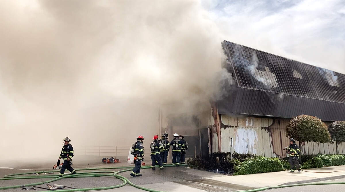 Firefighters battle a blaze at The Salvation Army Family Thrift Store and Donation Center on McHenry Avenue at Bangs Avenue in Modesto, Calif., on Thursday, June 2, 2022.