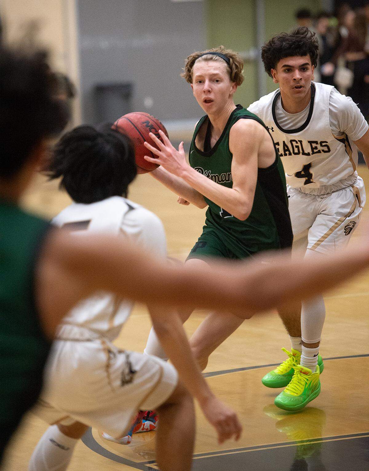 Pitman’s Avery Sanchez looks to pass the ball during the Central California Athletic League game with Enochs at Enochs High School in Modesto, Calif., Friday, Feb. 10, 2023. Pitman won the game 56-52.