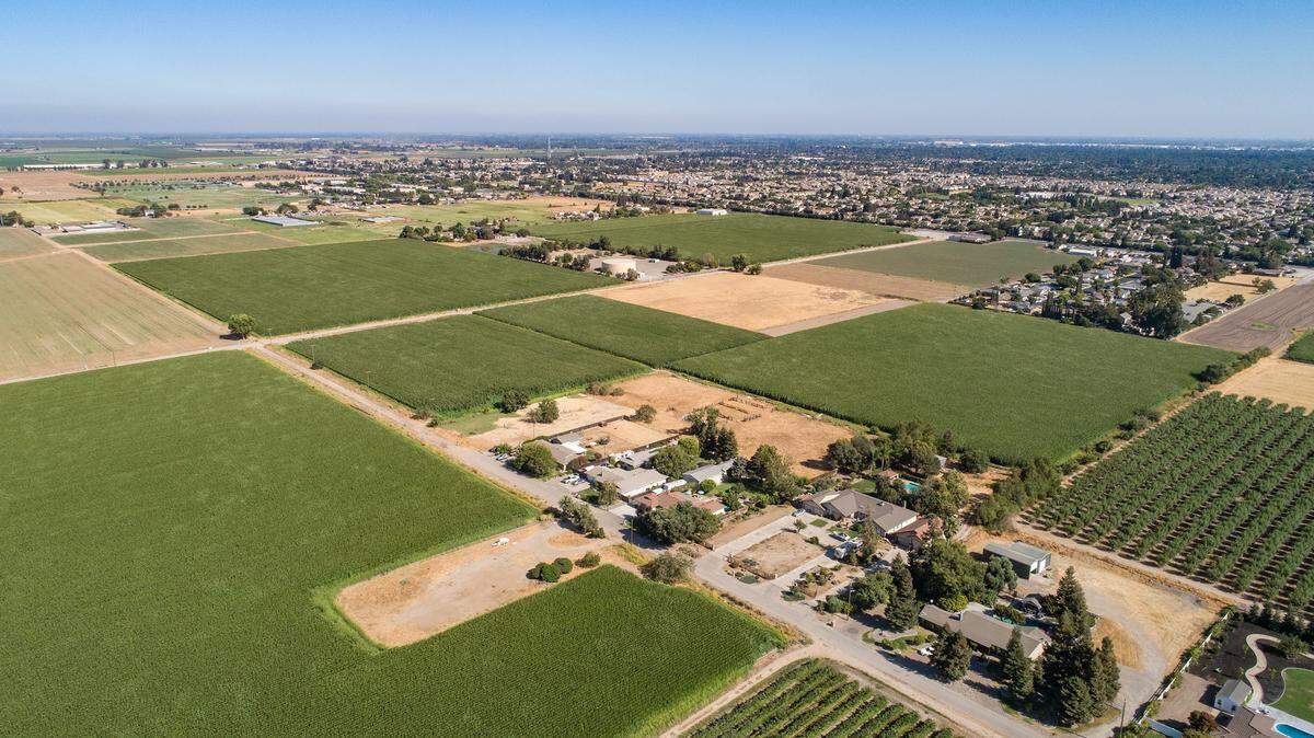 Future site of Tivoli housing development seen from Oakdale Road looking southeast toward Village One in Modesto, Calif., on Thursday, Aug. 5, 2021.