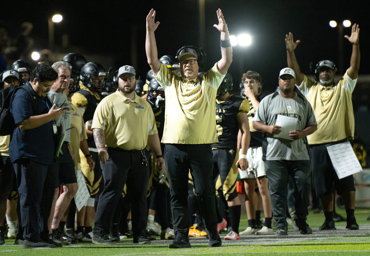Enochs coach Tracey Traub, middle, signals a touchdown after a close play at the goal line during the game with Beyer at Downey High School in Modesto, Calif., Friday, Aug. 23, 2024.
