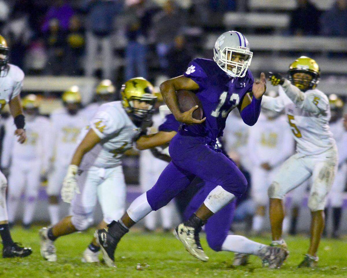 Denair running back Steffin Winston (13) sprints up field during the CIF Division 7-AA championship game between Denair and Santee at Denair High School in Denair California on December 1, 2018.