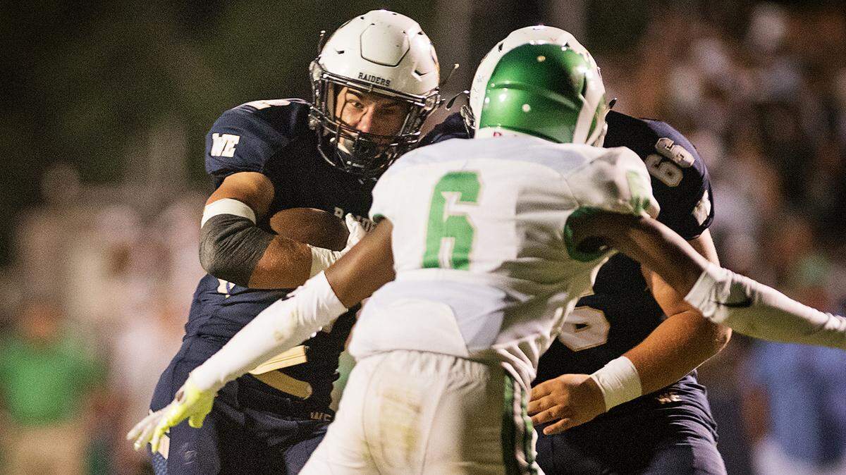 Central Catholic’s Kyle Jacklich breaks out on a first half touchdown run during the Holy Bowl game with St. Mary’s at Central Catholic High School in Modesto , Calif., August 31, 2018. 