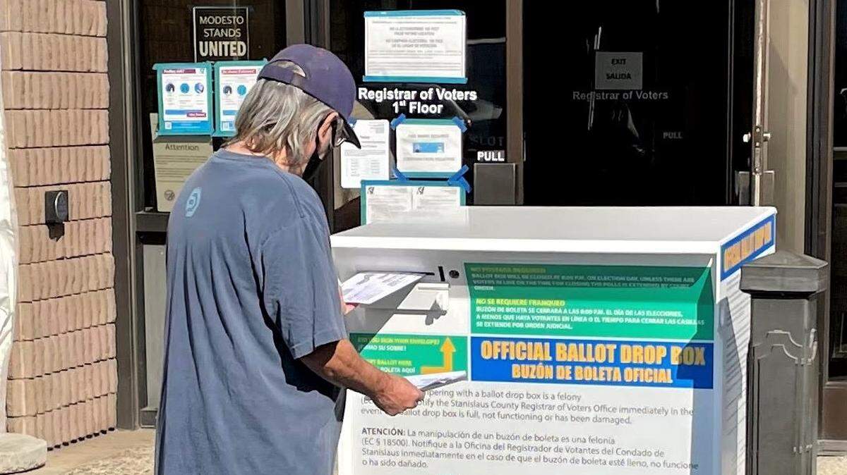 Michael Carrillo, of Hughson, drops off a ballot at the Stanislaus County Registrar of Voters office in Tuesday, Nov. 3, 2020.