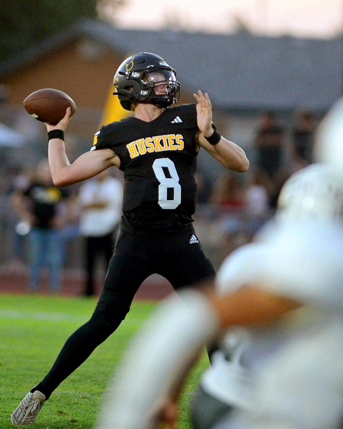 Hughson quarterback Robert McDaniel throws a deep pass during a game between Hughson High School and Central Valley High School at Hughson High School in Hughson California on August 25, 2023.