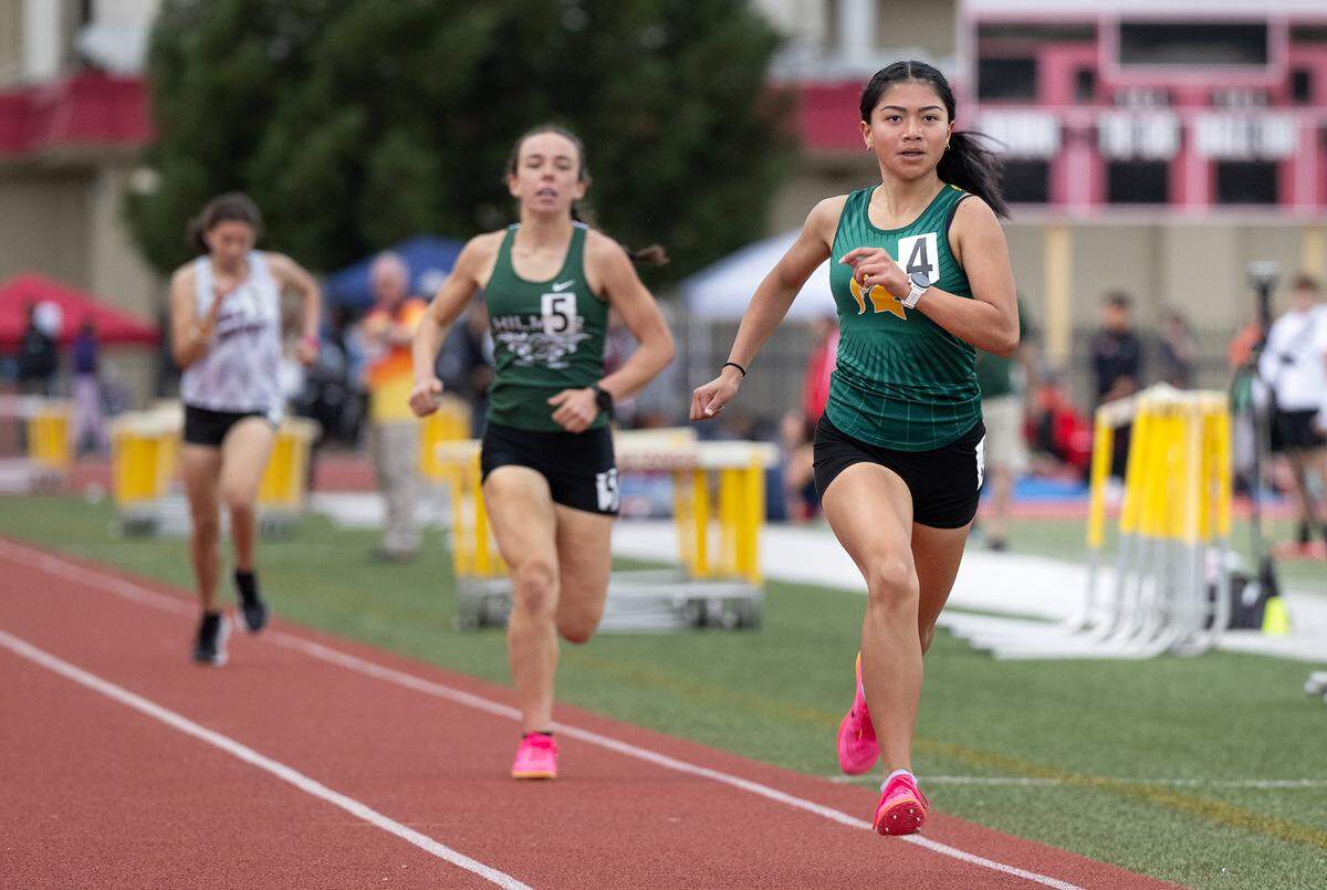 Davis runner Jymena Nguyen Marquez won the 1600 meter race with a time of 5:28.17 during the County Clash track meet at Oakdale High School in Oakdale, Calif., Friday, March 22, 2024. Hilmar’s Sophia Lopes (5) was second at 5:30.11.