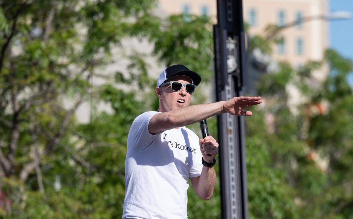 Jeff Pishney, chief executive officer and founder of Love Modesto speaks to the volunteers before they set out onto community projects as part of Love Modesto in Modesto, Calif., on Saturday, April 30, 2022.