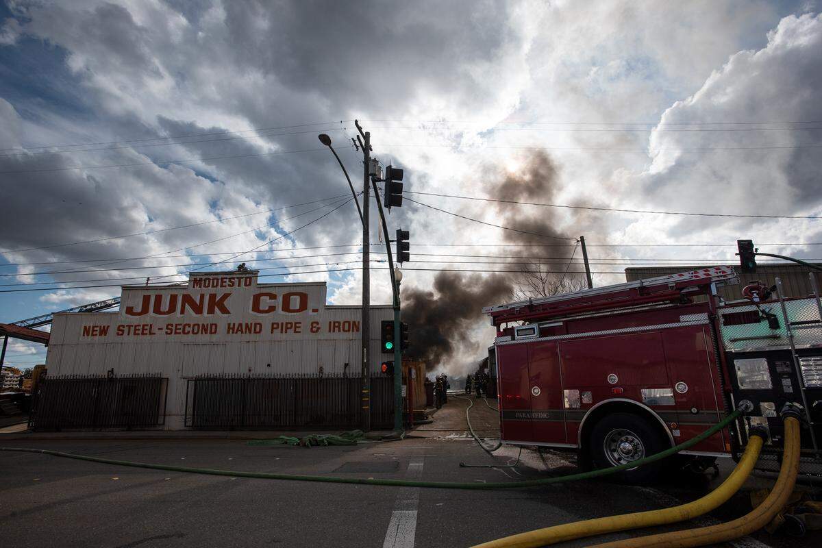 A fire at Modesto Junk Company recycling on 9th Street called for several fire engine and truck companies for containment in Modesto, Calif., Tuesday, March 7, 2023.