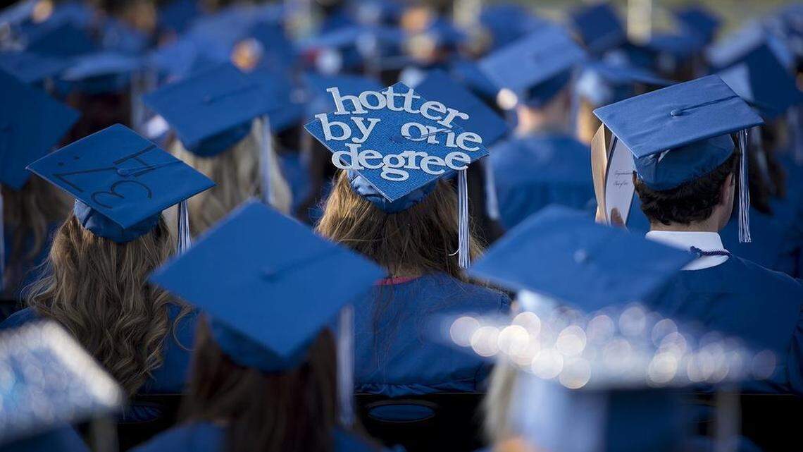 This May 1, 2015 file photo shows graduates listening to speakers during commencement at Modesto Junior College in Modesto, Calif. The college plans to do a virtual 2021 graduation ceremony because of COVID-19.