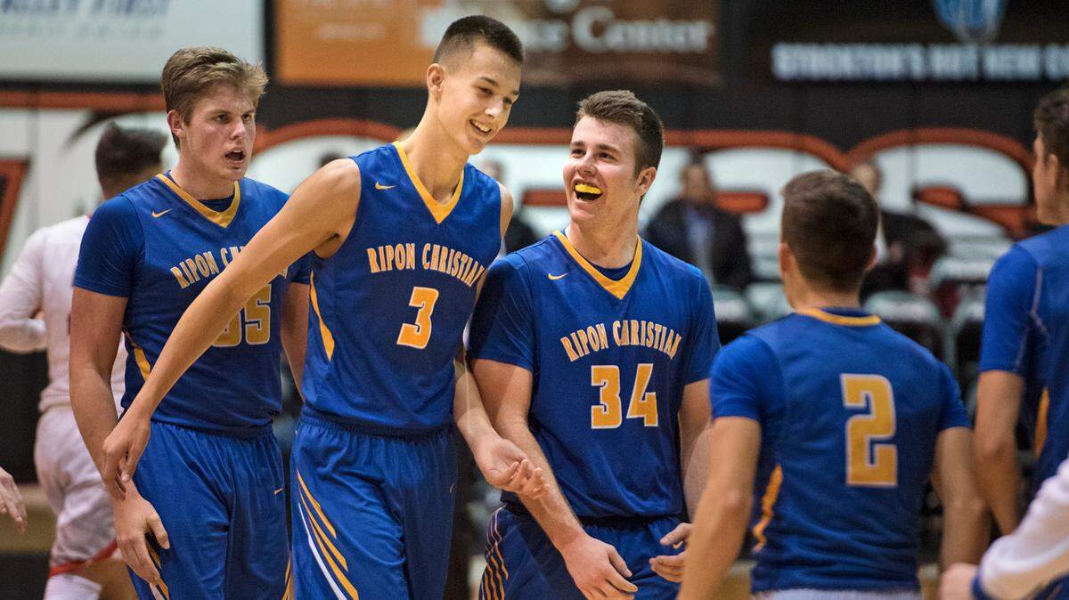 Ripon Christian players including Cade Alger (3) and come off the court after retaking the lead from Sacramento Adventist in the fourth quarter during the Sac-Joaquin Section Division VI championship game at the University of the Pacific in Stockton, Calif., on Friday, March 2, 2018.