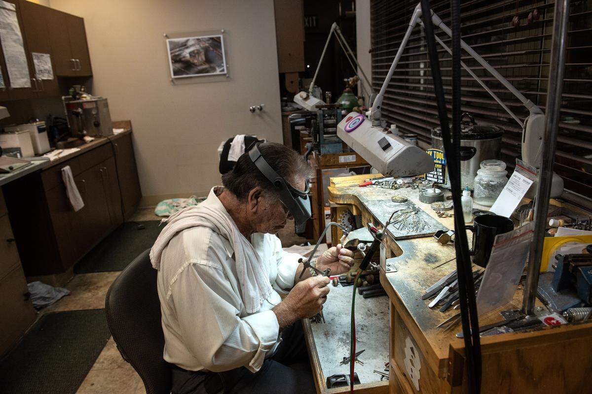 Jeweler Bill Rosario repairs a ring at Edwards Jewelers in Modesto, Calif., Wednesday, Nov. 9, 2022.