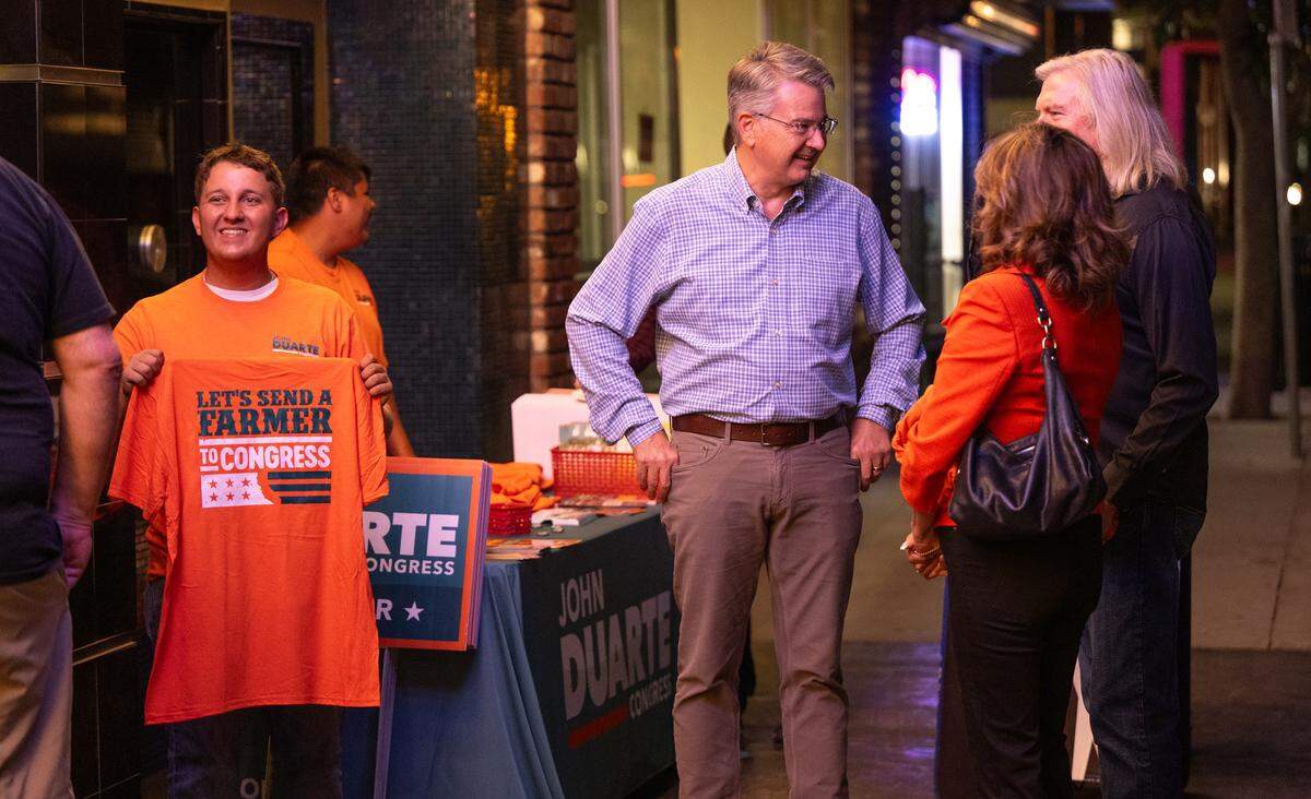 John Duarte, right, talks with with supporters outside the State Theatre before the California Congressional District 13 debate at the in Modesto, Friday, Oct. 25, 2024.