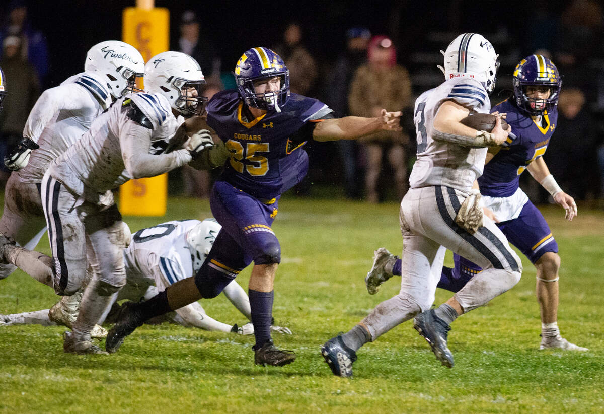 Escalon’s Ayden Wilson chases down Northwood’s Adam Harper in the CIF State Division 4-AA Football Championship game in Escalon, Calif., Saturday, Dec. 10, 2022. Escalon won the game 28-7.